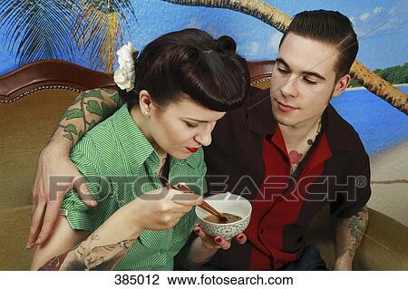 Young rockabilly couple sitting together View Large Photo Image Stock Image - Young rockabilly couple sitting together. Fotosearch
