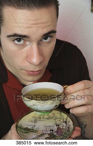 Young rockabilly man drinking tea View Large Photo Image Stock Photography - Young rockabilly man drinking tea. Fotosearch