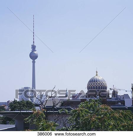 City skyline featuring the Television Tower and the New Synagogue, Berlin, Germany View Large Photo Image Stock Photograph - City skyline featuring the Television Tower and the New Synagogue, Berlin, Germany. Fotosearch