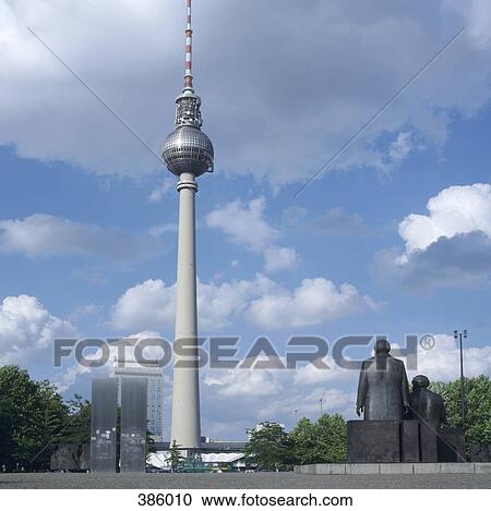 Stock Image - Soviet statues of Marx and Engels below the Television Tower, Berlin, Germany. Fotosearch