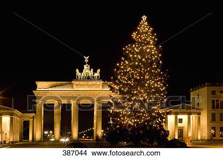 Illuminated Christmas tree in front of the Brandenburg Gate, Berlin, Germany View Large Photo Image Picture - Illuminated Christmas tree in front of the Brandenburg Gate, Berlin, Germany . Fotosearch