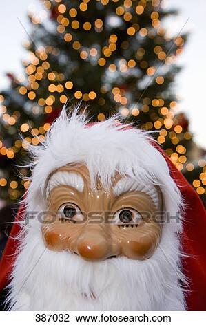 Person wearing a Santa Claus mask View Large Photo Image Stock Image - Person wearing a Santa Claus mask. Fotosearch