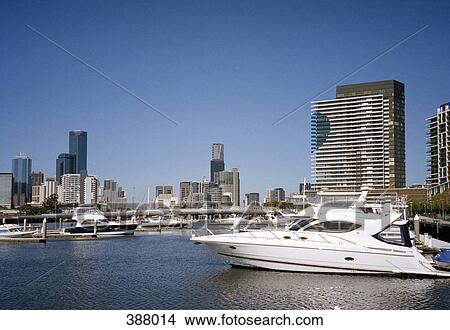 Picture - Cityscape behind boats moored in harbor, Sydney, Australia. Fotosearch