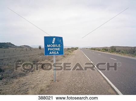 "Mobile phone area" road sign next to a two lane highway View Large Photo Image Stock Image - "Mobile phone area" road sign next to a two lane highway. Fotosearch