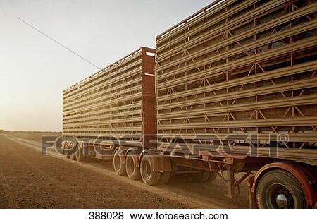 Stock Photo - Rear trailer of a semi-truck in a rural setting. Fotosearch