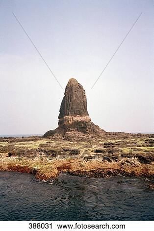 Rock formation in an arid landscape behind a river View Large Photo Image Stock Image - Rock formation in an arid landscape behind a river. Fotosearch