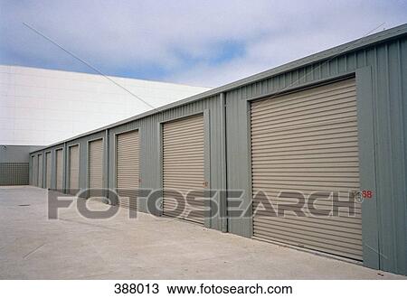 Warehouse with rolling garage doors View Large Photo Image Stock Image - Warehouse with rolling garage doors. Fotosearch