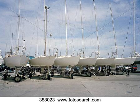 Yachts in a row on a jetty View Large Photo Image Stock Image - Yachts in a row on a jetty. Fotosearch