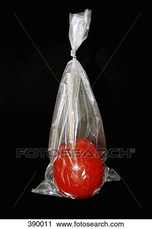 Toffee apple in a plastic bag View Large Photo Image Stock Image - Toffee apple in a plastic bag. Fotosearch
