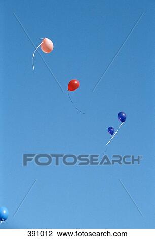 Colored balloons floating in the air View Large Photo Image Stock Image - Colored balloons floating in the air. Fotosearch