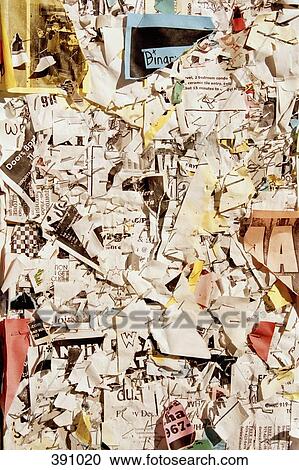 Stock Image - Ripped street posters on a notice board. Fotosearch