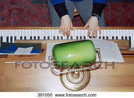 Stock Image - Woman playing the piano. Fotosearch