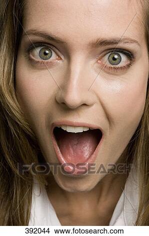 Close up of woman's face looking surprised View Large Photo Image Picture - Close up of woman's face looking surprised. Fotosearch