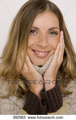 Stock Image - Portrait of a woman wearing turtleneck sweater. Fotosearch