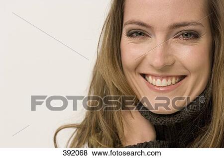 Stock Photo - Portrait of woman smiling. Fotosearch