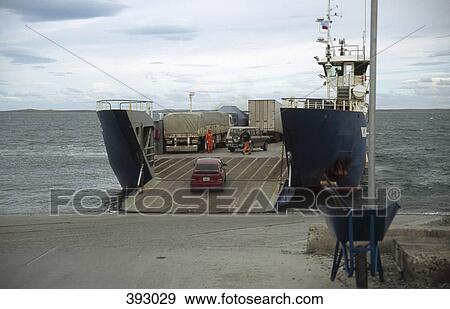 Cars and trucks loading onto a ferry View Large Photo Image Stock Photo - Cars and trucks loading onto a ferry. Fotosearch