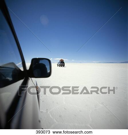 SUV's driving across salt flat, Salar de Uyuni, Bolivia View Large Photo Image Stock Image - SUV's driving across salt flat, Salar de Uyuni, Bolivia. Fotosearch