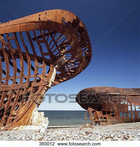 Two rusted ships on a pebble beach View Large Photo Image Stock Image - Two rusted ships on a pebble beach. Fotosearch