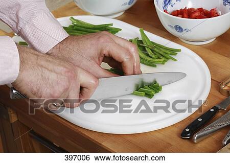 Chef chopping vegetables View Large Photo Image Stock Photograph - Chef chopping vegetables. Fotosearch