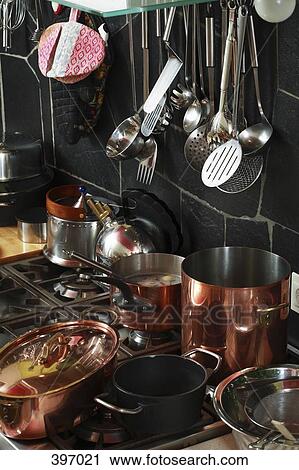 Stock Image - Kitchen utensils around a stove. Fotosearch