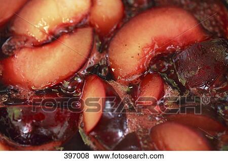 Plums cooking View Large Photo Image Stock Photo - Plums cooking. Fotosearch