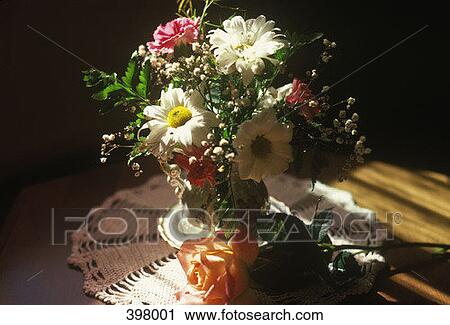 Vase of flowers in sunlight View Large Photo Image Stock Image - Vase of flowers in sunlight. Fotosearch