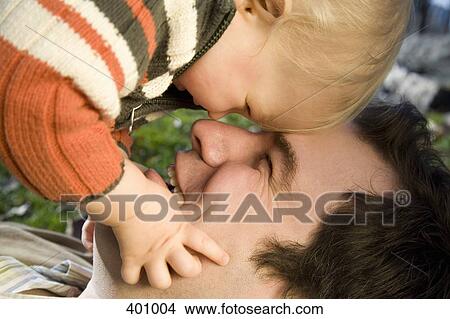 Young boy and father playing View Large Photo Image Picture - Young boy and father playing. Fotosearch