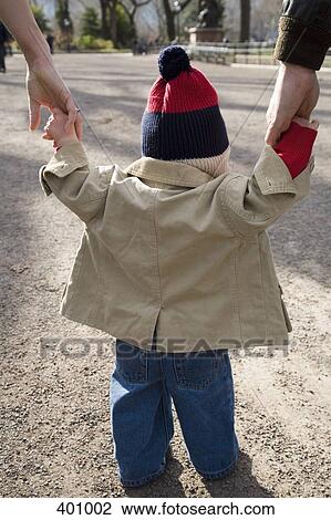 Young boy learning to walk View Large Photo Image Stock Image - Young boy learning to walk. Fotosearch