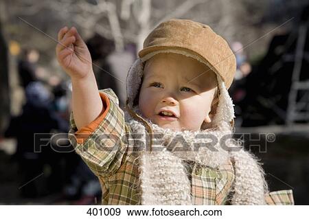 Young boy reaching View Large Photo Image Stock Photo - Young boy reaching. Fotosearch