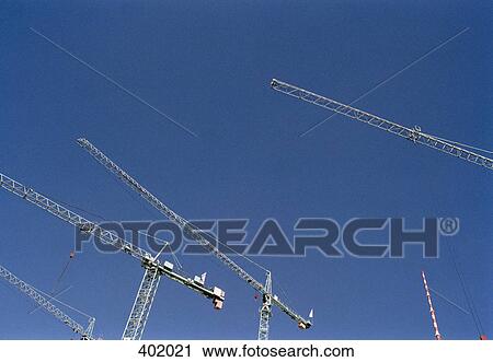 Stock Image - Low angle view of cranes. Fotosearch