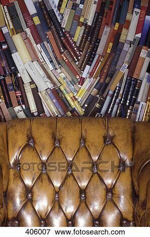 Books stacked behind a chair View Large Photo Image Stock Photo - Books stacked behind a chair. Fotosearch