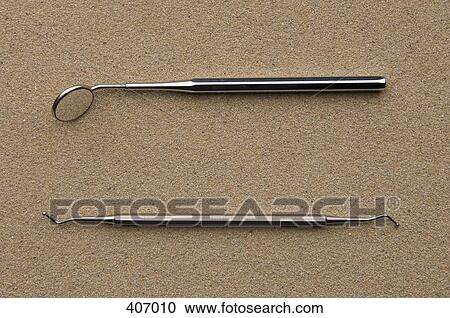 Stock Image - Angled Mirror and Plaque Remover. Fotosearch