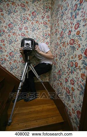 Photographer behind a camera View Large Photo Image Stock Image - Photographer behind a camera. Fotosearch