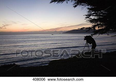 Photographer in front of ocean View Large Photo Image Stock Photograph - Photographer in front of ocean. Fotosearch