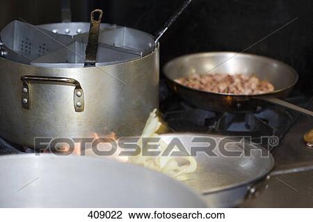 Pots and pans of food cooking on a stove View Large Photo Image Stock Image - Pots and pans of food cooking on a stove. Fotosearch