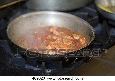 Prawn and tomato sauce cooking in a fry pan View Large Photo Image Stock Image - Prawn and tomato sauce cooking in a fry pan. Fotosearch