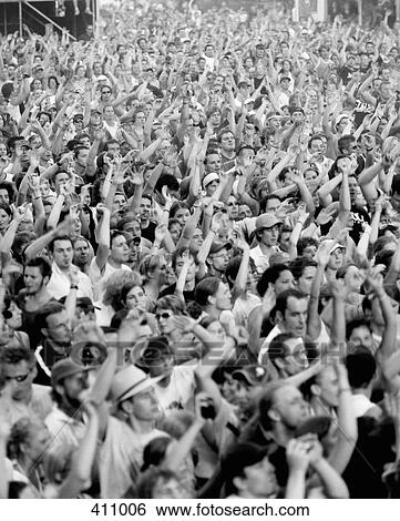Large crowd of people with their arms raised View Large Photo Image Stock Photograph - Large crowd of people with their arms raised. Fotosearch