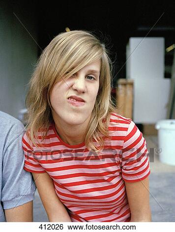 Stock Photograph - Young woman making a face. Fotosearch