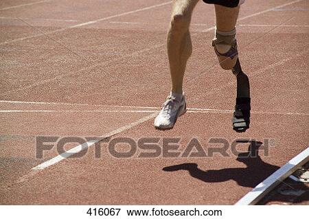 Athlete with a prosthetic leg running on a track View Large Photo Image Stock Photo - Athlete with a prosthetic leg running on a track. Fotosearch