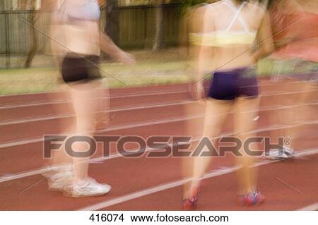Athletes standing together on a running track View Large Photo Image Picture - Athletes standing together on a running track. Fotosearch