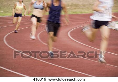 Group of athletes running on a track View Large Photo Image Stock Photo - Group of athletes running on a track. Fotosearch