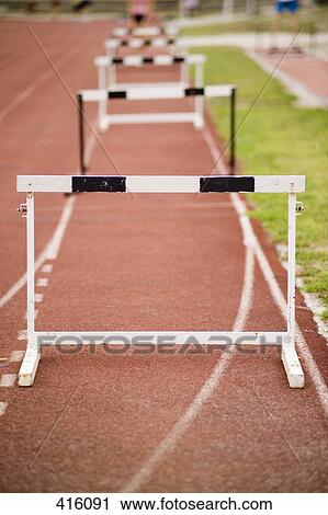 Hurdles arranged on a running track View Large Photo Image Stock Image - Hurdles arranged on a running track. Fotosearch