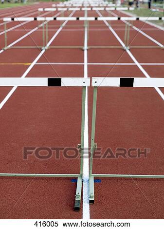 Hurdles arranged on a running track View Large Photo Image Stock Photography - Hurdles arranged on a running track. Fotosearch