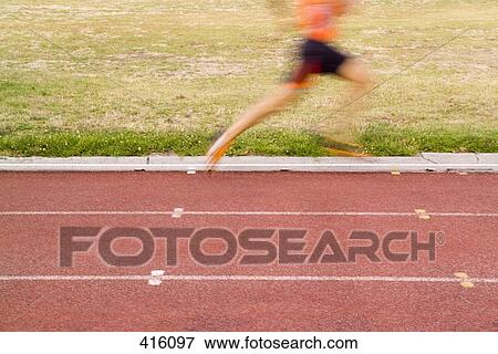 Male athlete running on a track View Large Photo Image Stock Photo - Male athlete running on a track. Fotosearch