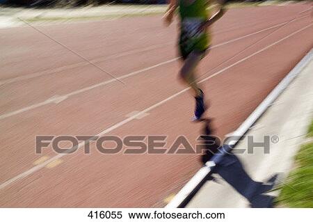 Male athlete running on a track View Large Photo Image Stock Photography - Male athlete running on a track. Fotosearch