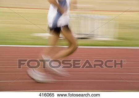Male athlete running on a track View Large Photo Image Stock Photography - Male athlete running on a track. Fotosearch