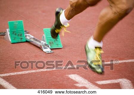 Man running from starting blocks View Large Photo Image Stock Photo - Man running from starting blocks. Fotosearch