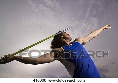 Stock Photograph - Man throwing a javelin. Fotosearch