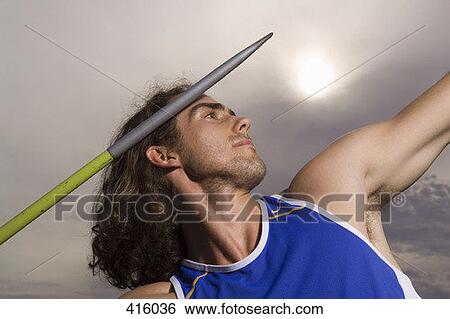 Man throwing a javelin View Large Photo Image Stock Photograph - Man throwing a javelin. Fotosearch