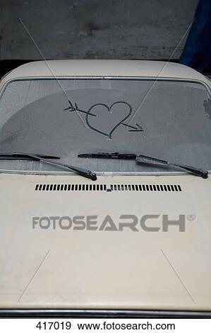 Heart and arrow drawn onto frosted windshield View Large Photo Image Stock Photo - Heart and arrow drawn onto frosted windshield. Fotosearch